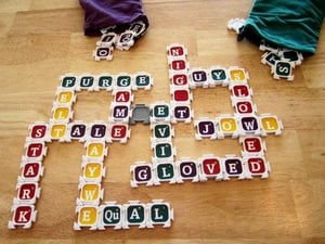 Image showing several Nab-It game pieces set up on a wooden floor