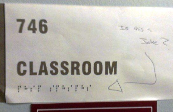 A paper sign with printed braille characters on it A paper sign with printed braille characters on it