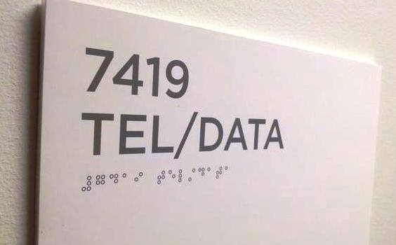 Office sign with printed braille characters instead of embossed braille characters Office sign with printed braille characters instead of embossed braille characters
