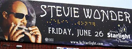 Billboard promoting a Stevie Wonder concert with braille characters spelling his name Billboard promoting a Stevie Wonder concert with braille characters spelling his name