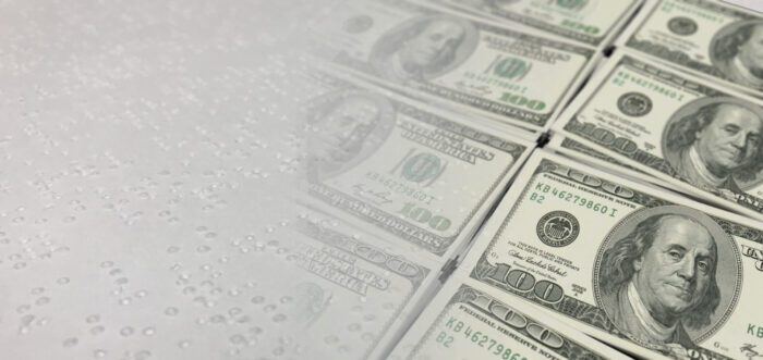 Braille fades into money