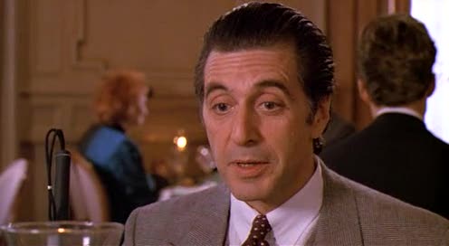 Frank Slade (Al Pacino) sitting at a table in a fancy restaurant during a scene of Scent of a Woman Frank Slade (Al Pacino) sitting at a table in a fancy restaurant during a scene of Scent of a Woman
