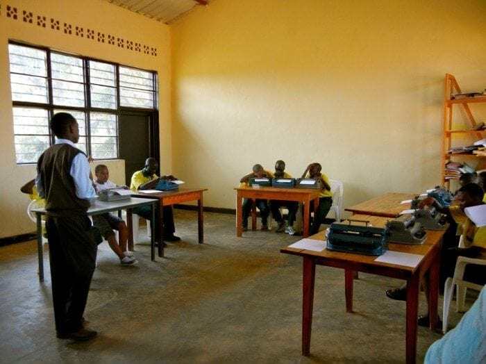 Image showing Eric Niyikiza teaching a class at the HVP Gatagara School for the Visually Impaired.