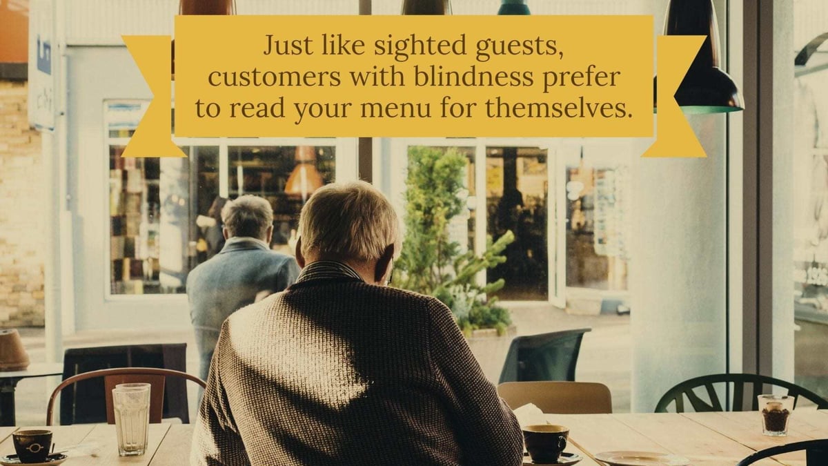 Man sitting alone at a restaurant table with a text overlay reading "Just like sighted guests, customers with blindness prefer to read your menu for themselves." Man sitting alone at a restaurant table with a text overlay reading "Just like sighted guests, customers with blindness prefer to read your menu for themselves."