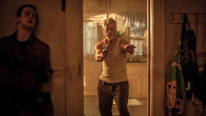 "The Blind Man" played by Stephen Lang walking through a doorway holding a handgun. "The Blind Man" played by Stephen Lang walking through a doorway holding a handgun.