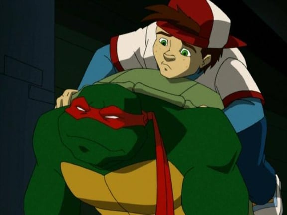 Raphael carrying a kid on his back. The boy helps to orient Raphael after he is blinded during episode of Teenage Mutant Ninja Turtles. Raphael carrying a kid on his back. The boy helps to orient Raphael after he is blinded during episode of Teenage Mutant Ninja Turtles.