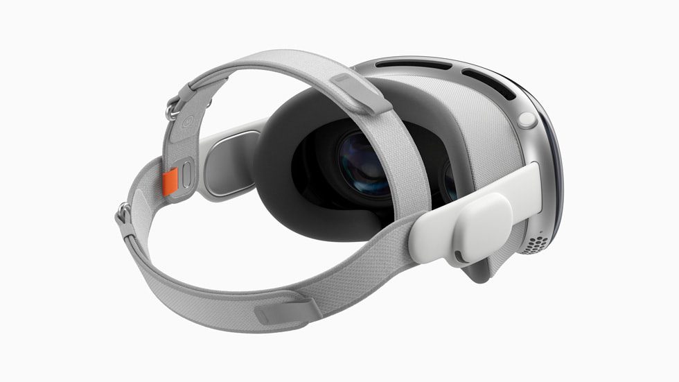 Apple's Vision Pro headset with large googles and straps both over and around the head.
