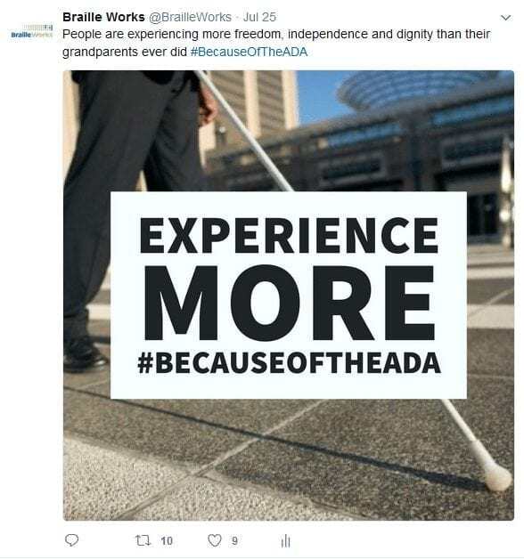 individual with white cane walking across town