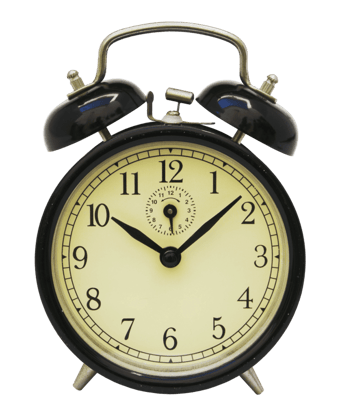 Old alarm clock with bells on the top and manual hands indicating it's 10:03